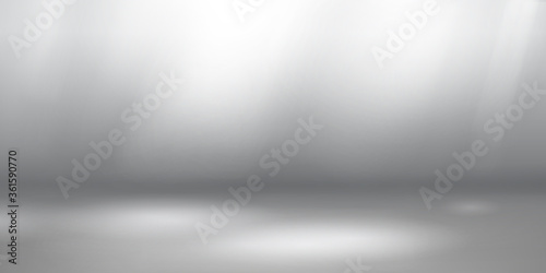 Empty studio background with soft lighting in white and gray colors