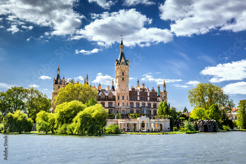 Schwerin Castle looking like a fairy tale castle surrounded by a wonderful landscape composed of lakes and forests 