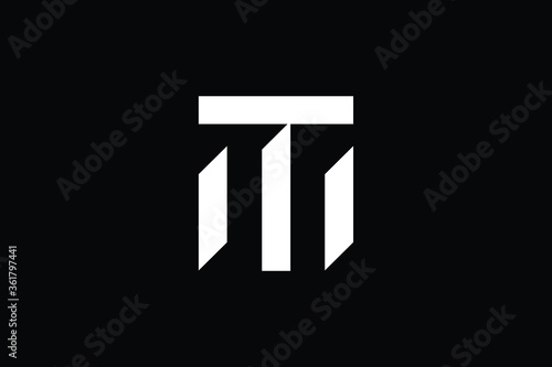 Minimal elegant monogram art logo. Outstanding professional trendy awesome artistic TM MT initial based Alphabet icon logo. Premium Business logo White color on black background
