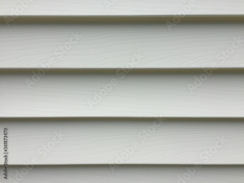 Recently cleaned vinyl siding on a white house