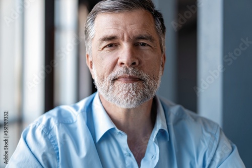 Portrait of mature business man looking at camera. Copy space.