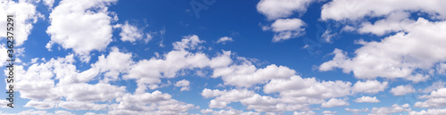 Clouds in blue sky. White, fluffy clouds In blue sky. Background nature. Texture cumulus floating on blue sky. Backgrounds concept. Environment, atmosphere. Place for an inscription or logo