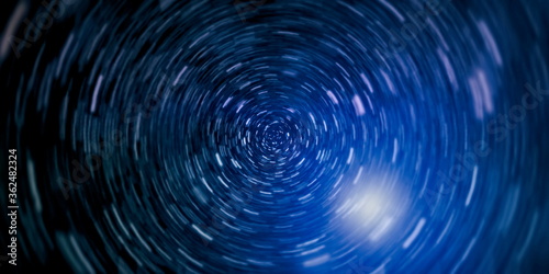 Space Travelling in the Speed of Light. Abstract of warp or hyperspace motion in blue star trail.