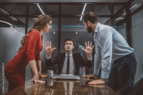 Lawyer trying to stop the argument between spouses