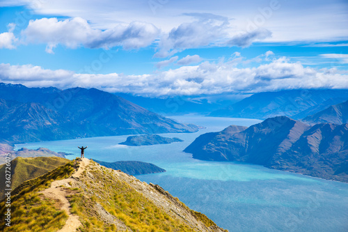 Roys peak mountain hike in Wanaka New Zealand. Popular tourism travel destination. Concept for hiking travel and adventure. New Zealand landscape background. 