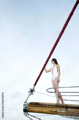 A lady standing at the edge of a cruise