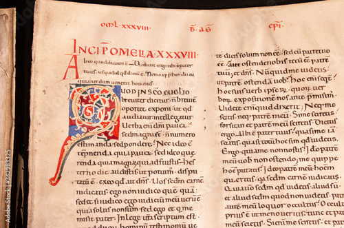 A vellum manuscript leaf of Augustine's homilies on John's Gospel written in Tuscany in the twelfth century. Showing an illuminated capital letter. 