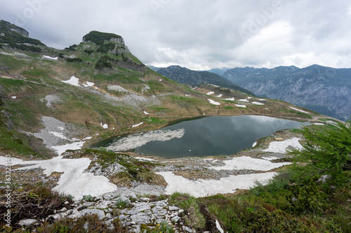 Lake in the austrian Alps with last snow. Augstsee. Loser. Austria