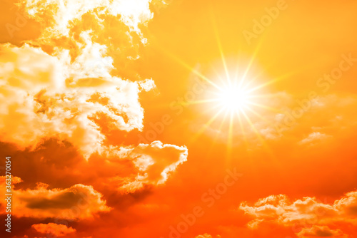 Hot Summer or heat wave background, orange sky with burning sun