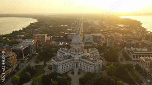 Aerial view of City of Madison. The capital city of Wisconsin from above. Drone flying over Wisconsin State Capitol in downtown. Sunny morning, sunrise (sunset), sunlight, summertime