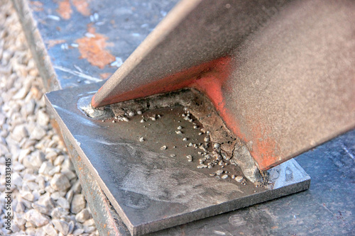 Welding slag. Welding slag is a form of slag or vitreous material produced as a by product of some arc welding processes. This is a slag of the shielded metal arc welding.