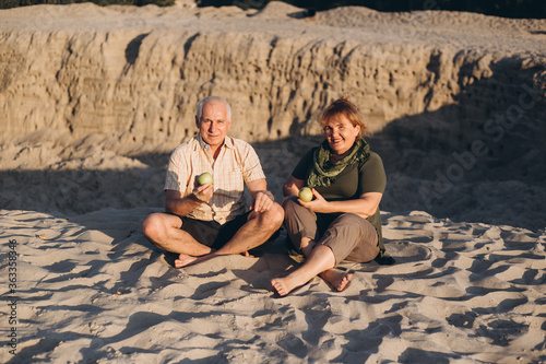 Senior elder caucasian couple together in beach in summer