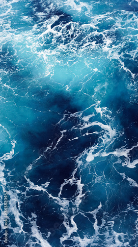 Background of the sea surface, foam stains on clean fresh ocean water. Vertical photo aerial view