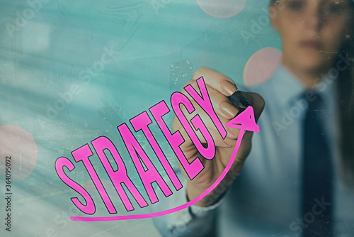 Handwriting text Strategy. Conceptual photo action plan or strategy designed to achieve an overall goal digital arrowhead curve rising upward denoting growth development concept