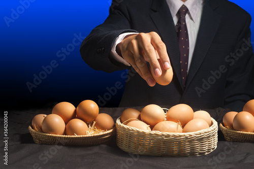 smart businessman allocate egg into many baskets . do not put all eggs in one basket 