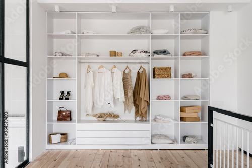 Modern and large wardrobe in dressing room