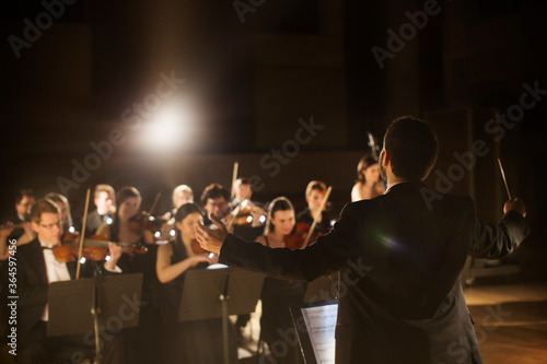 Conductor leading orchestra