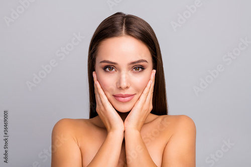 Close up photo lovely charming gorgeous girlish brown hair lady touch hands face look mirror enjoy her soft wellness skin after skin care spa salon treatment isolated grey color background.