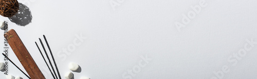 top view of aroma sticks, stones, stand and decorative ball on white background, panoramic shot