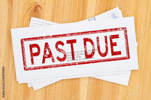 Past Due word message on business envelope addresses to IRS