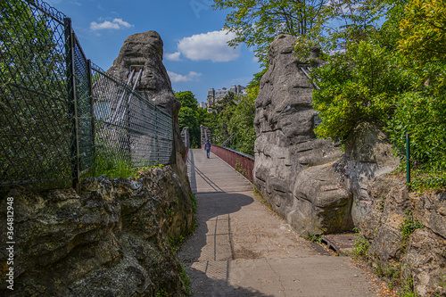 63-meter-long suspension bridge (1867) in Buttes-Chaumont Park (Parc des Buttes-Chaumont, 1867) - Public Park situated in northeastern Paris, fifth-largest park in Paris. Paris. France.