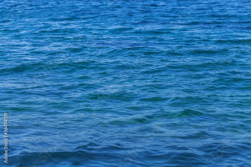Small waves on the blue sea water. Nature background, travel vacation