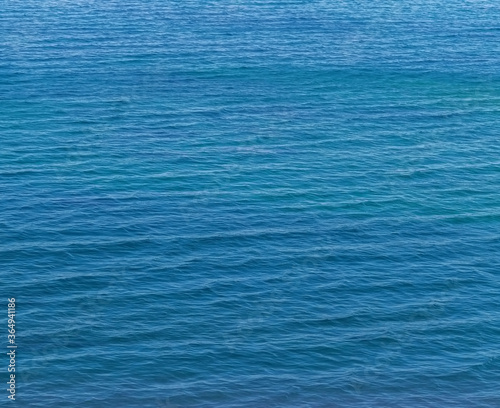 Small waves on the blue sea water. Nature background, travel vacation