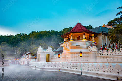 Temple of the tooth, a Buddhist temple also known as Sri Dalada Maligawa, covered with fog in Kandy, Sri Lanka. morning view, well famous destination among tourists. 