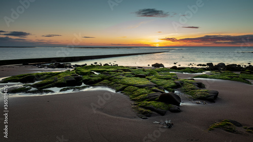 Sunrise at Cresswell Beach on the coast of Northumberland, England, UK.