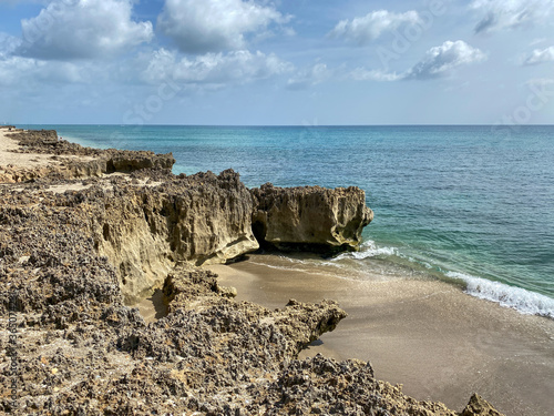 A rocky beach with clear turquoise water in Stuart, FL