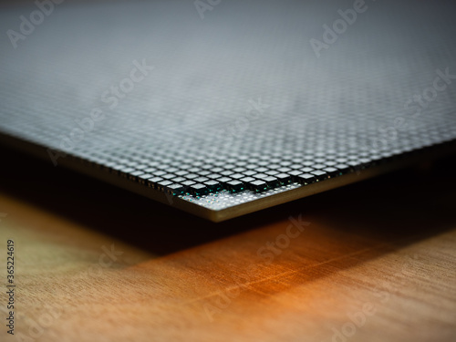 Closeup of corner of an LED video screen with shallow depth of field and some emitters removed