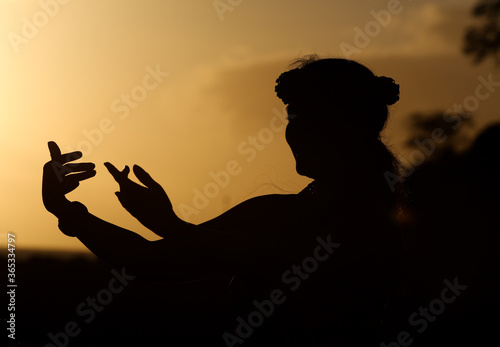 Beautiful silhouette of a Hula Dancer at Sunset on the Hawaiian Island of Maui