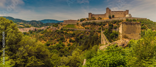 A fortress looks down on the Tower Bridge and gorge at Spoleto, Italy in summer