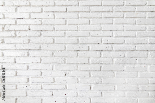 White brick walls that are not plastered background and texture. The texture of the brick is white. Background of empty brick basement wall.