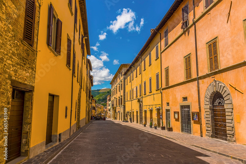 A deserted street at siesta time in the city of Gubbio, Italy in summer