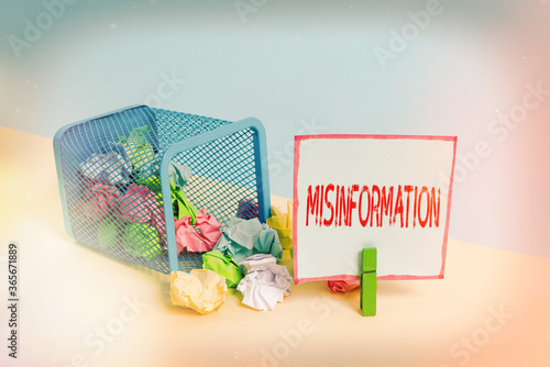 Word writing text Misinformation. Business photo showcasing false data, in particular, intended intentionally to deceive Trash bin crumpled paper clothespin empty reminder office supplies tipped