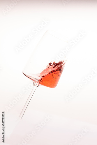 Glass of rose lambrusco wine in a splash