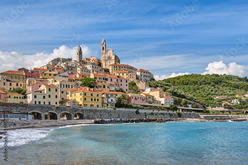 Imperia Cervo beach and San Giovanni Battista church in Liguria. Old medieval town in Italy. Travel destination. Mediterranean sea.