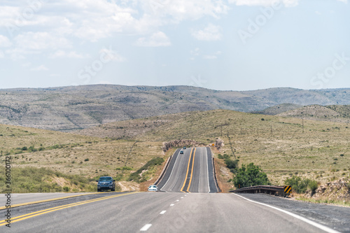 Roswell, New Mexico USA countryside rural town road view from 380 highway with desert landscape and cars