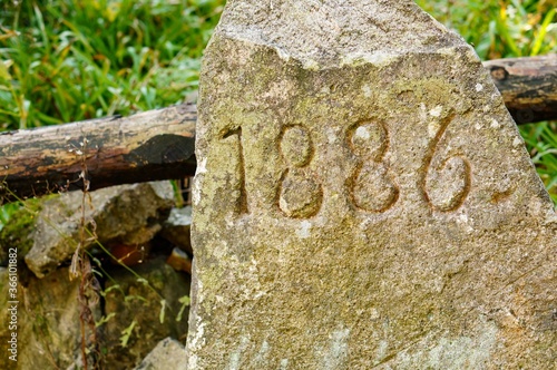 1886 engraved on stone