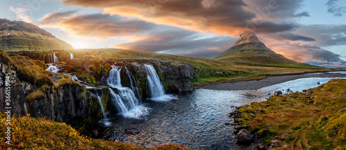 Scenic image of Iceland. Great view on famouse Mount Kirkjufell With Kirkjufell waterfall during sunset. Wonderful Nature landscape. Popular Travel destinations. Picture of wild area