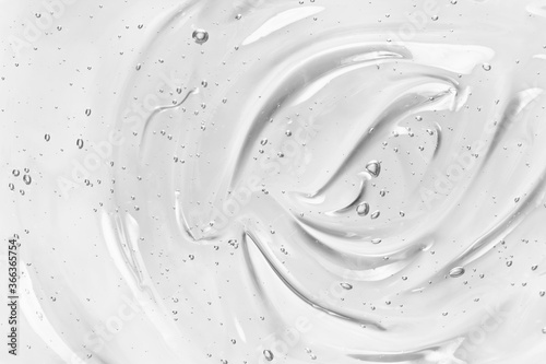 Face serum or gel texture. Clear skincare cream with bubbles background. Transparent cosmetic gel product strokes closeup