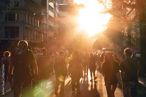 New York City 2020 - Crowd of people walk into the light of sunset at a peaceful Black Lives Matter protest march on 14th Street in Manhattan