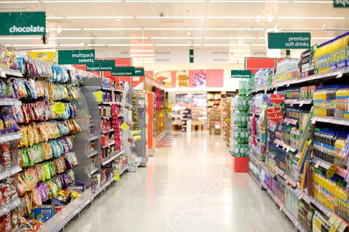 Supermarket aisle filled with a collection of groceries