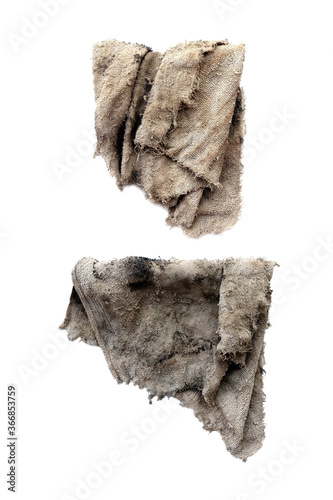 Old dirty torn rag isolated on white background. Cleaning rag.