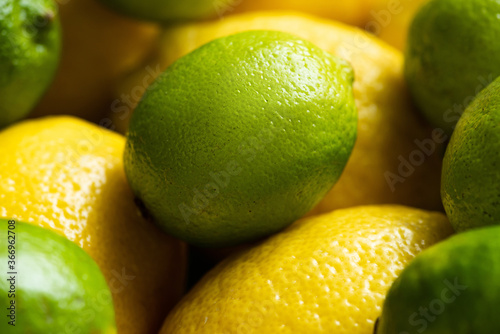 close up view of fresh ripe lemons and limes