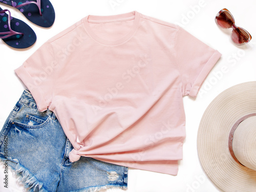 Mockup of a pink t-shirt placed between some beach accessories