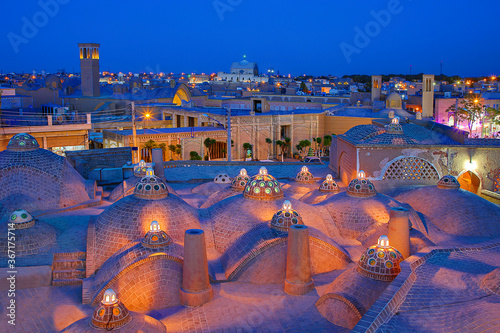 Domes of historical bath and view over the ancient city of Kashan at the twilight, Iran