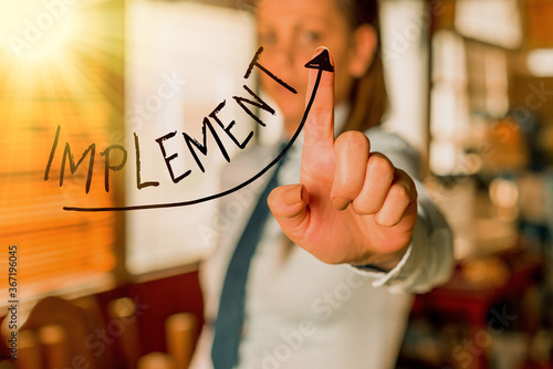 Text sign showing Implement. Business photo text to provide instruments or means of expression for something digital arrowhead curve rising upward denoting growth development concept