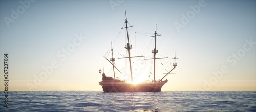 Sailing vessel sailing in the ocean with sunset.